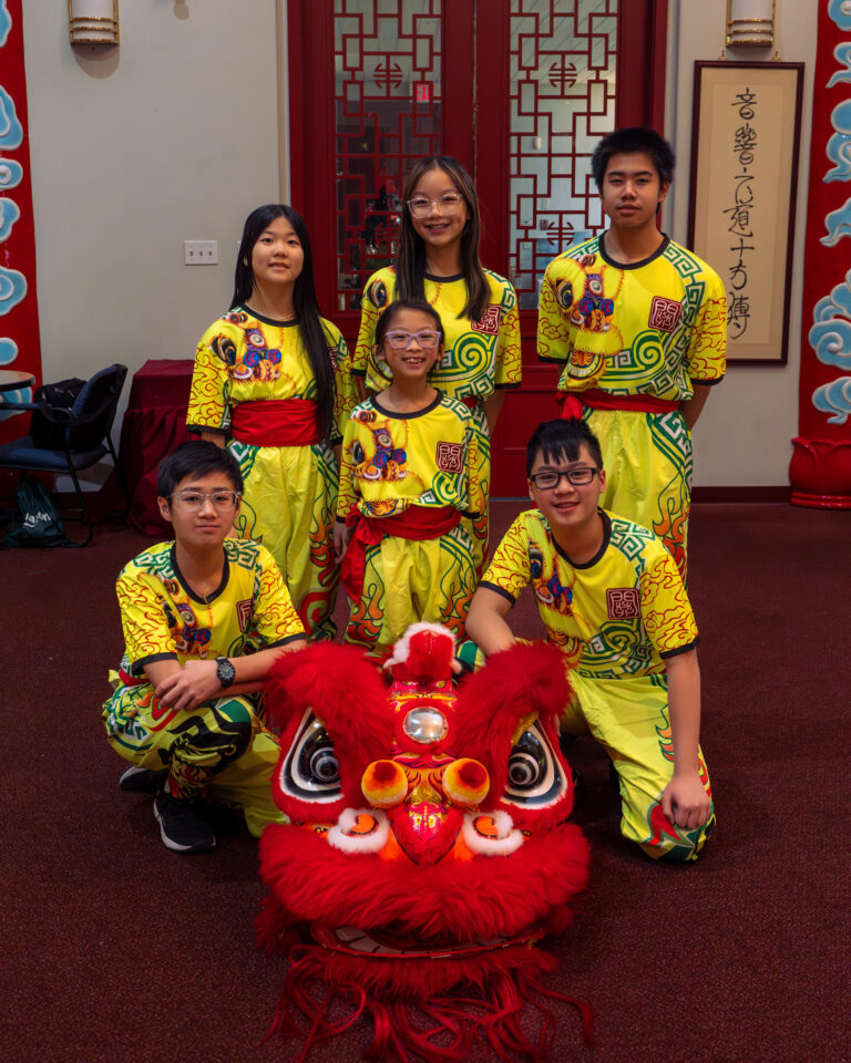 Edmonton KSK junior team members posing with their red Chinese lion.