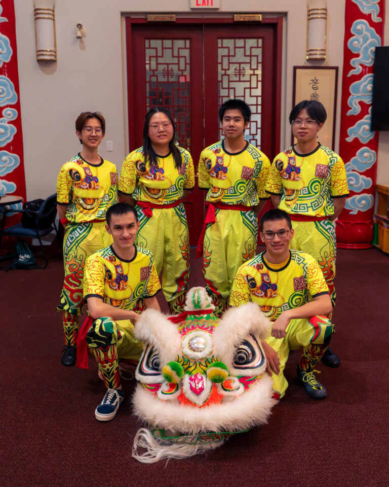 Edmonton KSK team B members posing with their green and white lion.